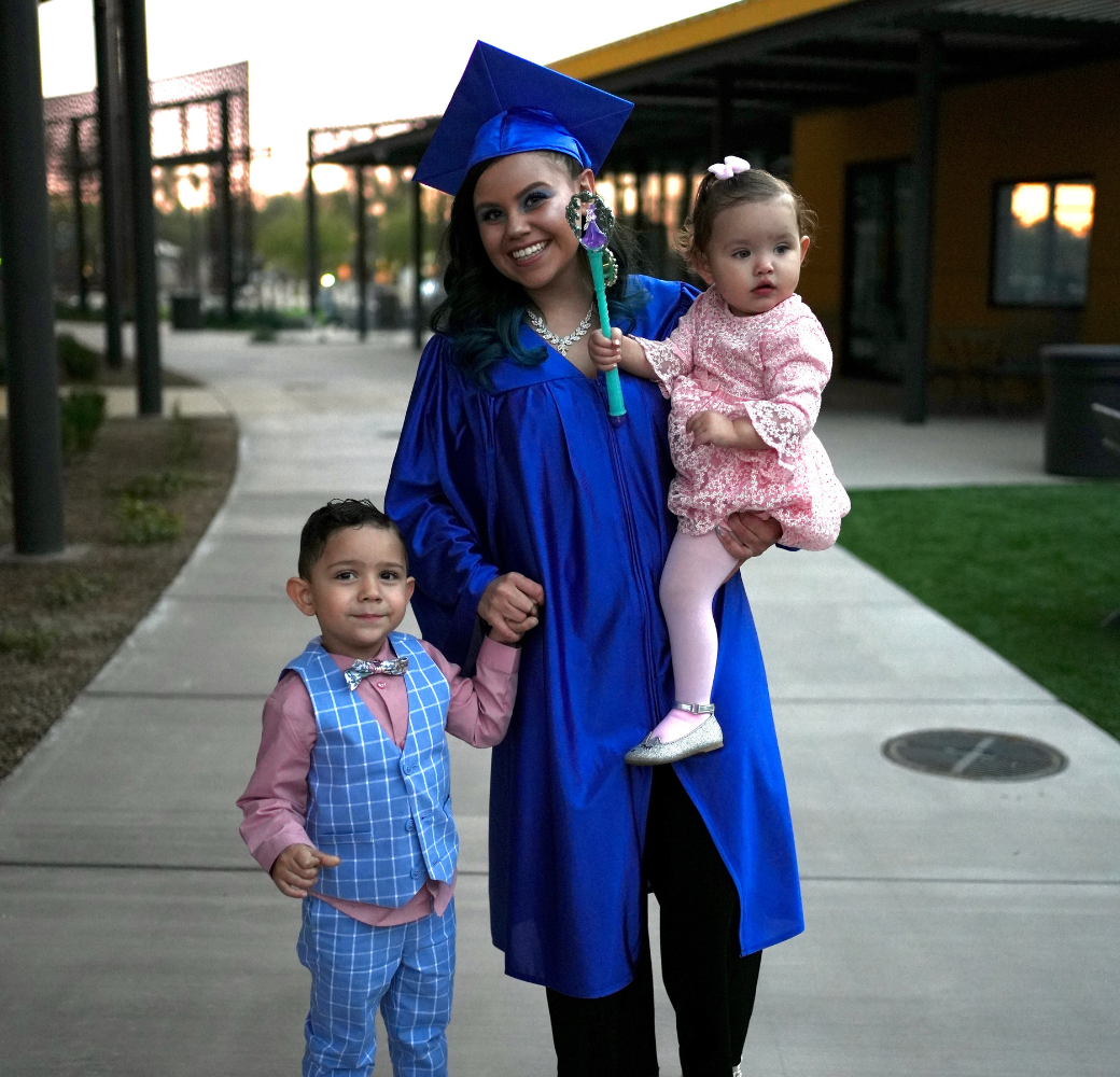 Grad Solutions student on graduation day with her children
